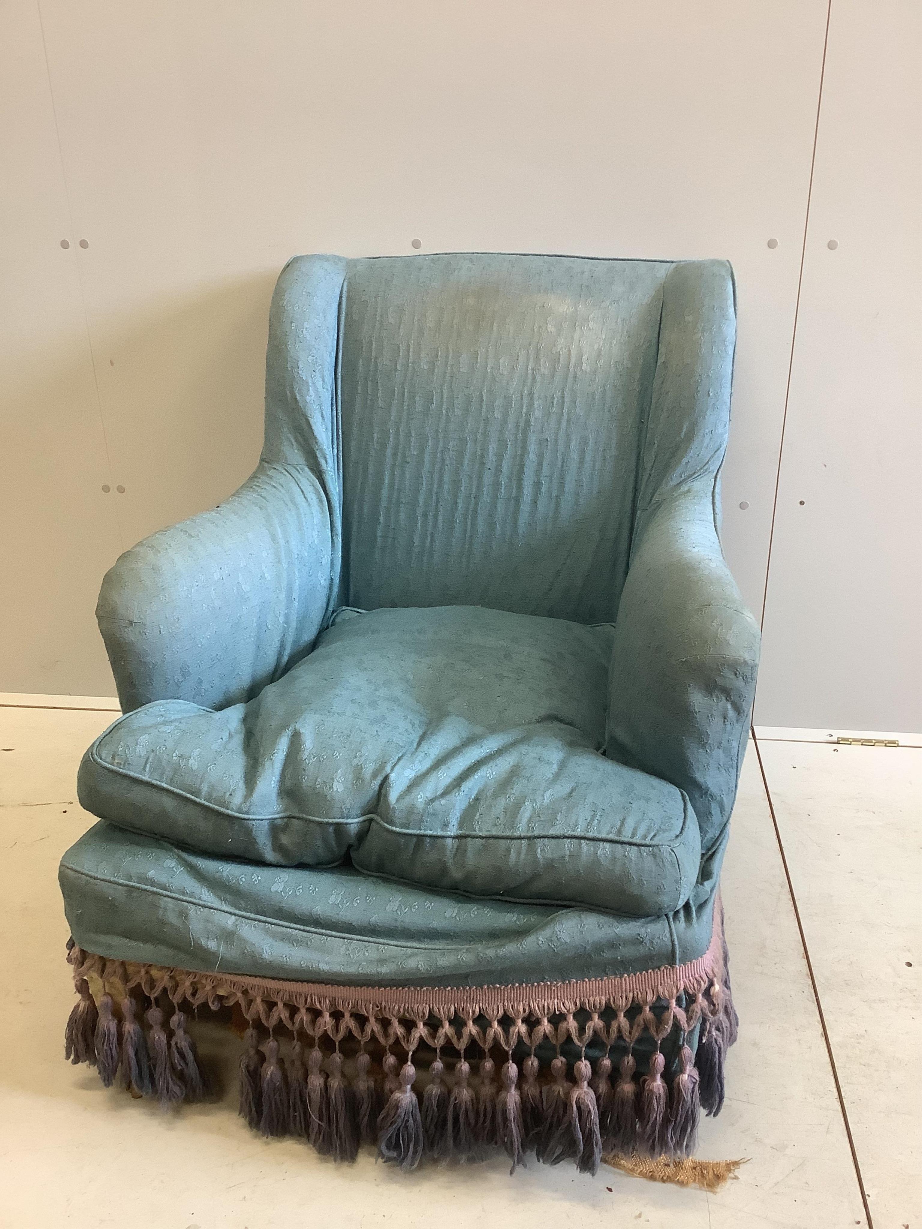 A Victorian blue upholstered Howard style wing armchair, width 72cm, depth 90cm, height 87cm. Condition - poor to fair